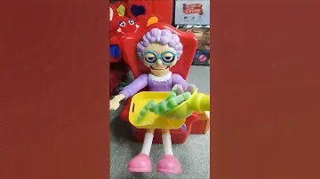 Giving 🧓😋 her favourite trolli dinorex gummies 🟢🦖🦕🟣🍬