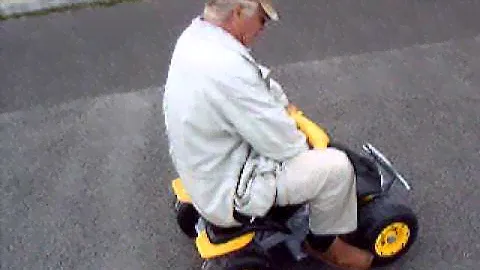 Dad riding the Peg-Perego Corral T-Rex