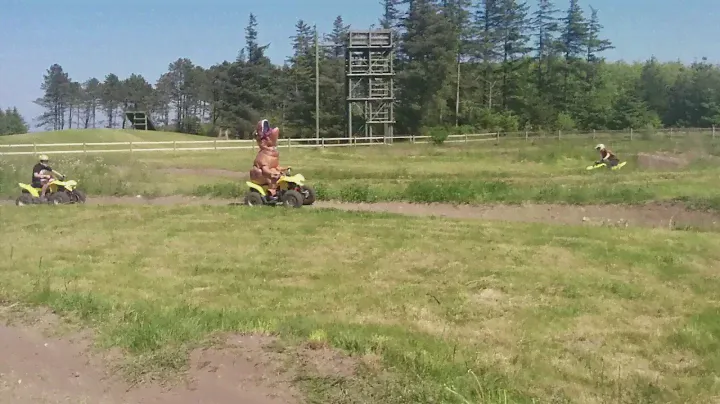 T-Rex driving ATV