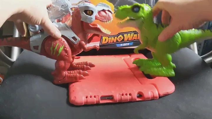 Green and Red Trex Zuru Robo Alive.  Watch them in action roaring and moving.